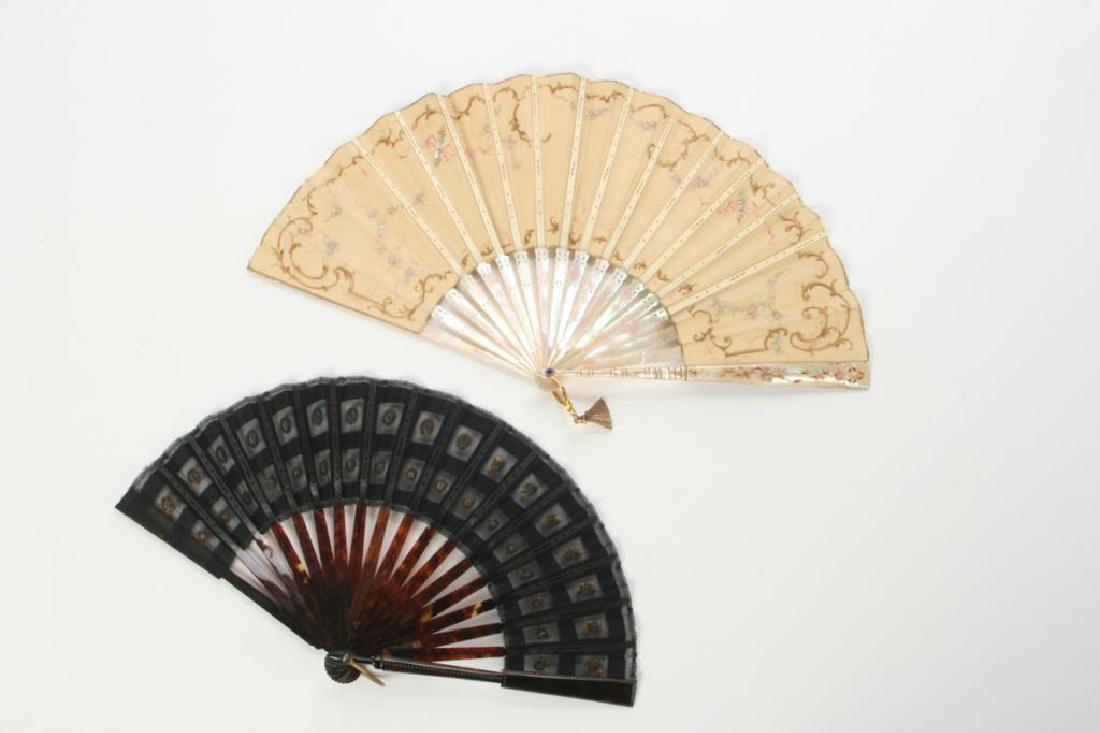 TWO FANS INCLUDING TIFFANY: Hand painted French garden scene signed Bonnez. Pierced abalone, sapphire ended and brass fan tassel. Tiffany & Co. New York. Length 10 1/4 inches. The second is faux tortoise and lace. Length 8 inche