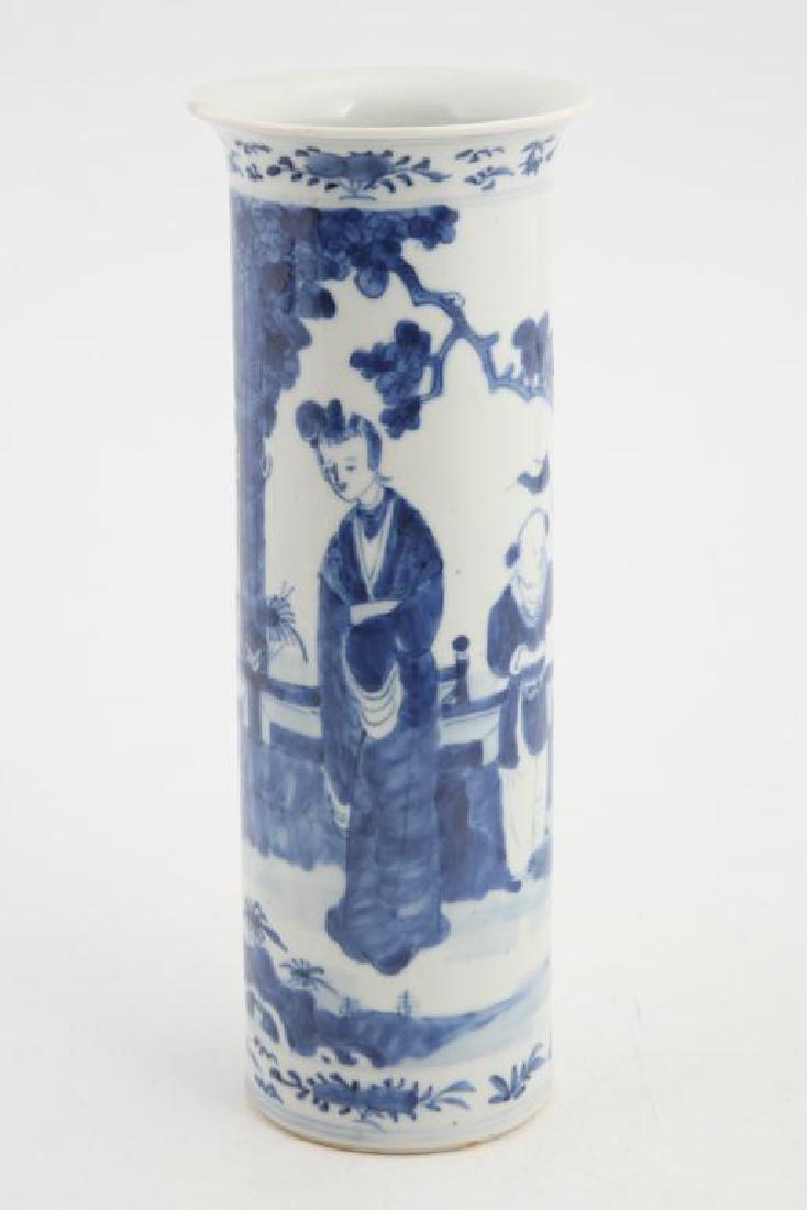CHINESE BLUE AND WHITE PORCELAIN VASE: Tall cylindrical form vase hand painted with figures on patio. Height 12 inches.
