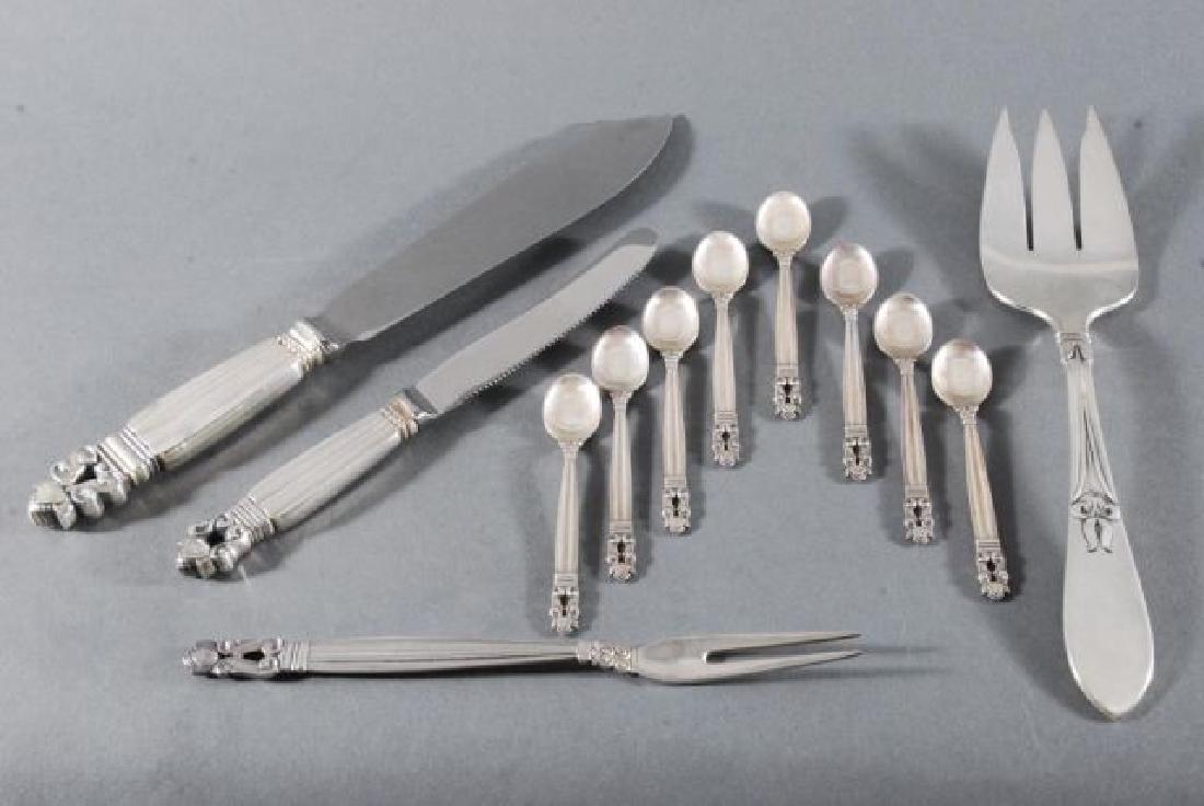 (11) PIECES OF GEORG JENSEN STERLING SILVER etc.: Including: (8) demi tasse spoons, juvenile knife, two prong fork, cake knife (8 1/2 inches) and a three prong fork by another maker.