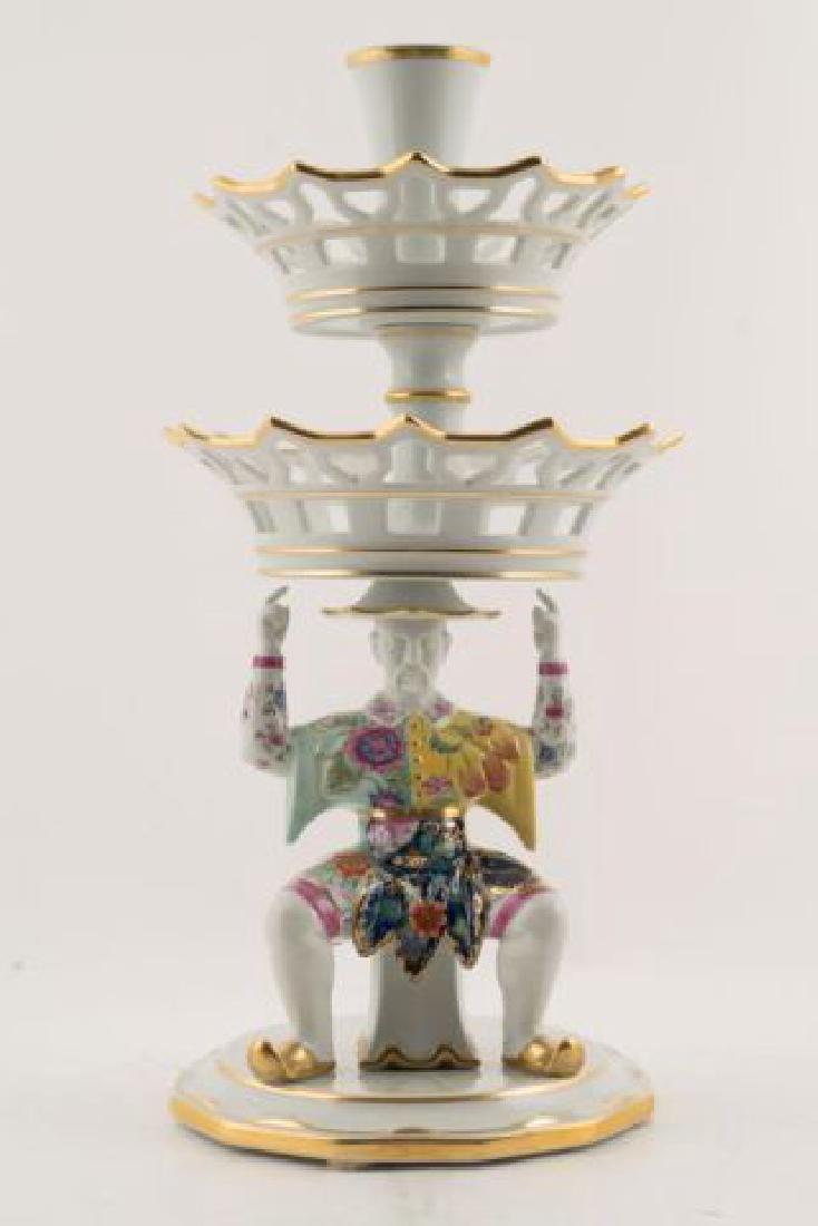 TOBBACO LEAF MAN EPERGNE by MOTTAHEDEH: Chinese man supports two graduating pierced baskets and vase. Hand painted in vibrant colors. Height 17 1/4 inches. signed.