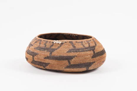 EARLY CALIFORNIA POMO INDIAN BASKET: Coil construction with alternating woven colored patterns and beads. 3 1/4 x 7 x 8 1/2 inches. It is well documented that Andy showered Jon Gould with gifts during their entire relationship. This