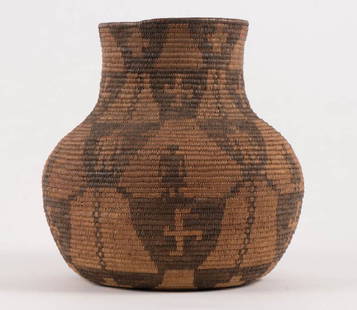 FIGURAL NATIVE AMERICAN INDIAN BASKET: Probably Apache. Coil construction with alternating colored twine forming geometric figures and patterns. height 11 inches. It is well documented that Andy showered Jon Gould with gifts during their e