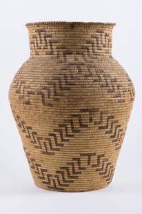 LARGE APACHE INDIAN BASKET: Coil construction wove with darker twine to form a repeating geometric pattern. height 24 inches. It is well documented that Andy showered Jon Gould with gifts during their entire relationship.