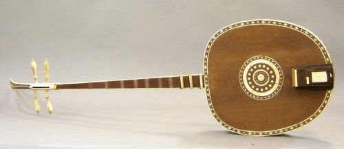 A south seas bone-inlaid musical string instrument,: A south seas bone-inlaid musical string instrument, from the estate of Al Capp