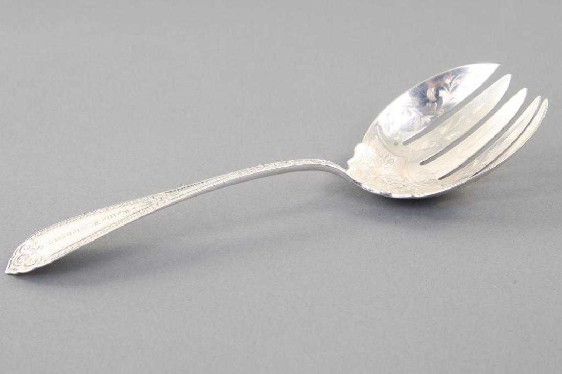FARRINGTON AND HUNNEWELL COIN SILVER SALAD PIECE: Elaborately stippled, bright cut and engraved. "Hattie Stevens from Mr. and Mrs. J.B. Clement August 28, 1873". 9 1/2 inches. 3.64 troy ounces.