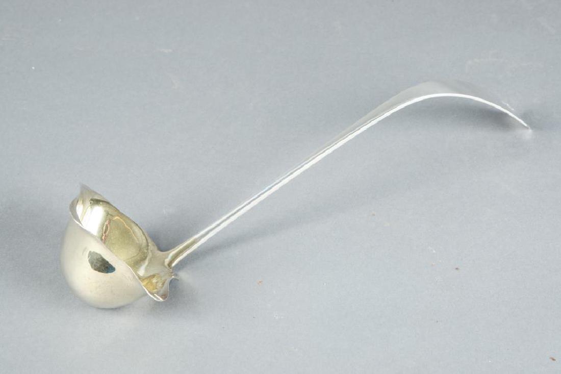 ARTISAN QUALITY STERLING SILVER PUNCH LADLE: Coffin ended heavy handle, gold washed bowl with left and right handed pours. illegible hallmark. 13 inches. 6.54 troy ounces.