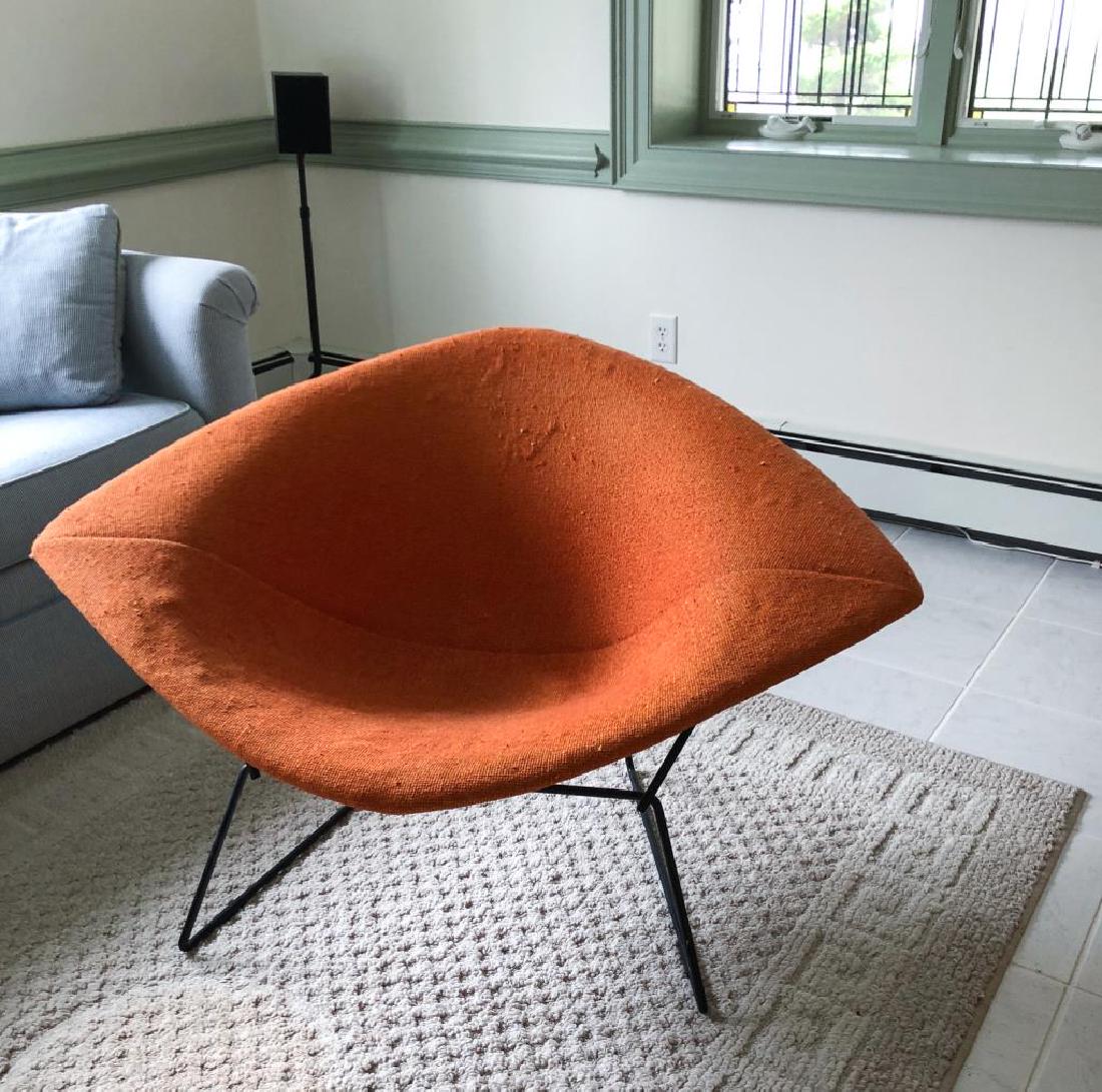 KNOLL BERTOIA "DIAMOND" LOUNGE CHAIR In orange: In orange upholstery 27 x 35 x 45 inches.