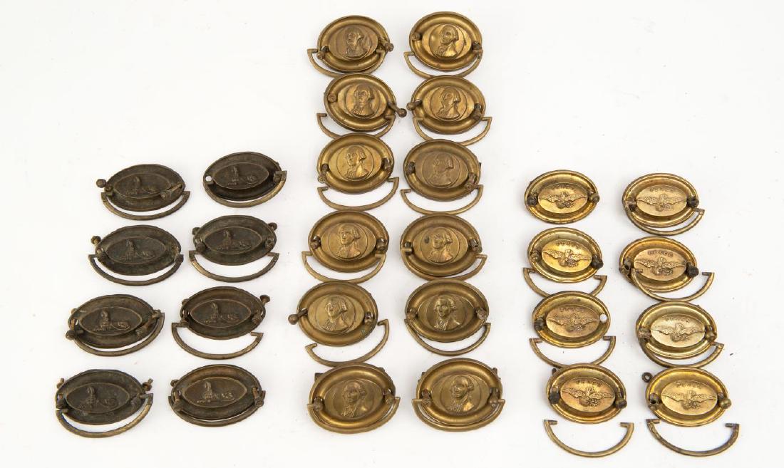 28 FEDERAL STAMPED OVAL BRASSES: Including "Peace" with dove example - 8 plates, 7 bails, 15 posts, and 2 nuts. 2 1/4 x 3 inches; Sphinx examples - 8 places, 8 bails, 15 posts, 15 nuts; Washington examples - 12 plates, bails, and pos