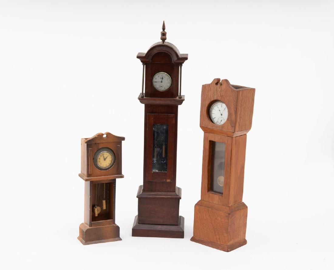 THREE (3) WATCH HUTCHES IN TALLCASE CLOCK MOTIFFS (1 of 7)