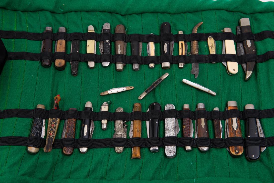 OVER 25 POCKET KNIVES, INCLUDING RARE NAZI EXAMPLE: Nazi aluminum two blade (8 1/4 inches open) knife has eagle on one side of handle and "DAIMLER-BENZ-F. SCHICHAU / ELBING / R&M" on other side of handle. Other knives by Roker, Case, Syracuse, Ka-Bar, 