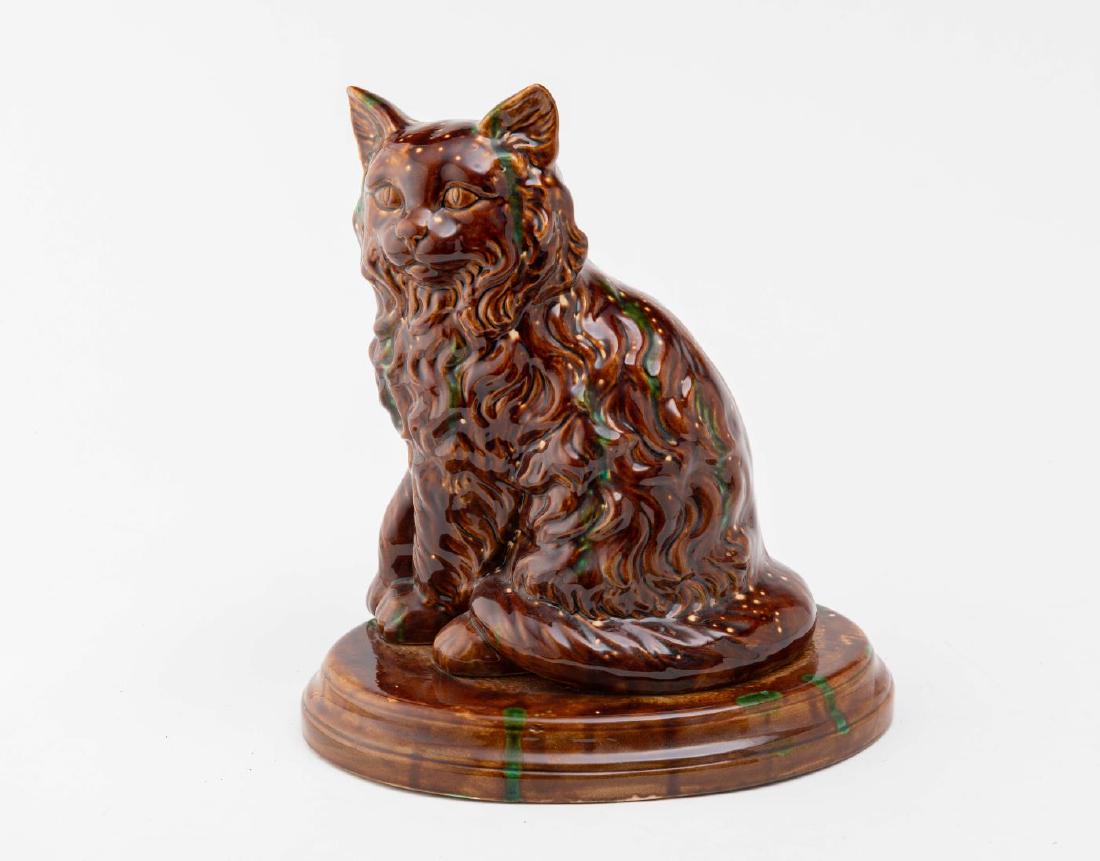 LARGE ROCKINGHAM GLAZED CAT WITH GREEN HIGHLIGHTS (1 of 4)