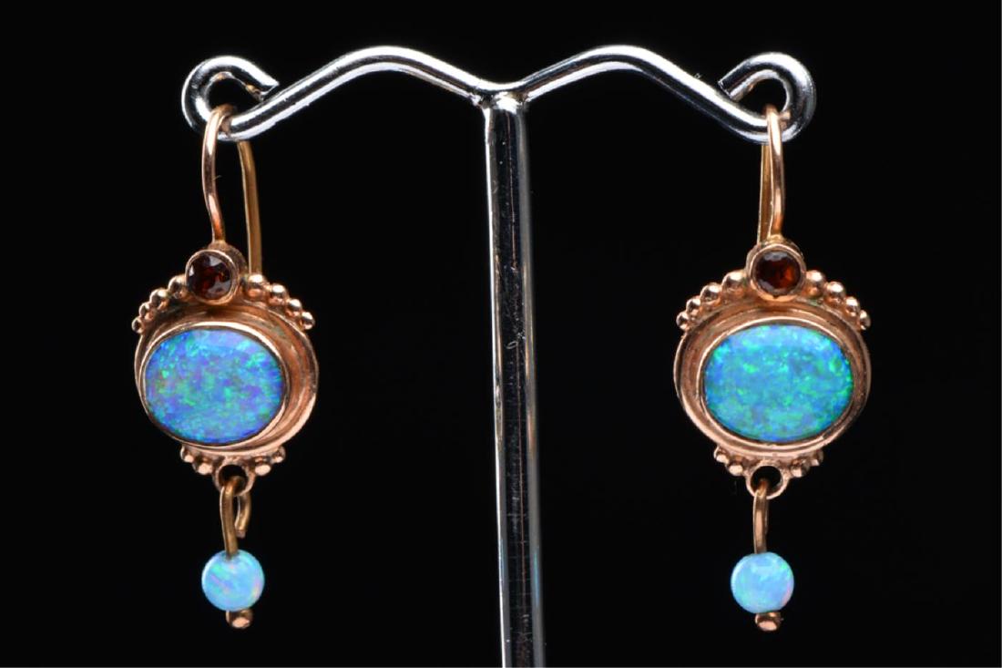 PAIR OF 14K ROSE GOLD & BLUE GREEN OPALS: Set with garnet accents. 1 1/4 inches (including ear wires) 3.5 dwt Condition: Good Temp No 5970