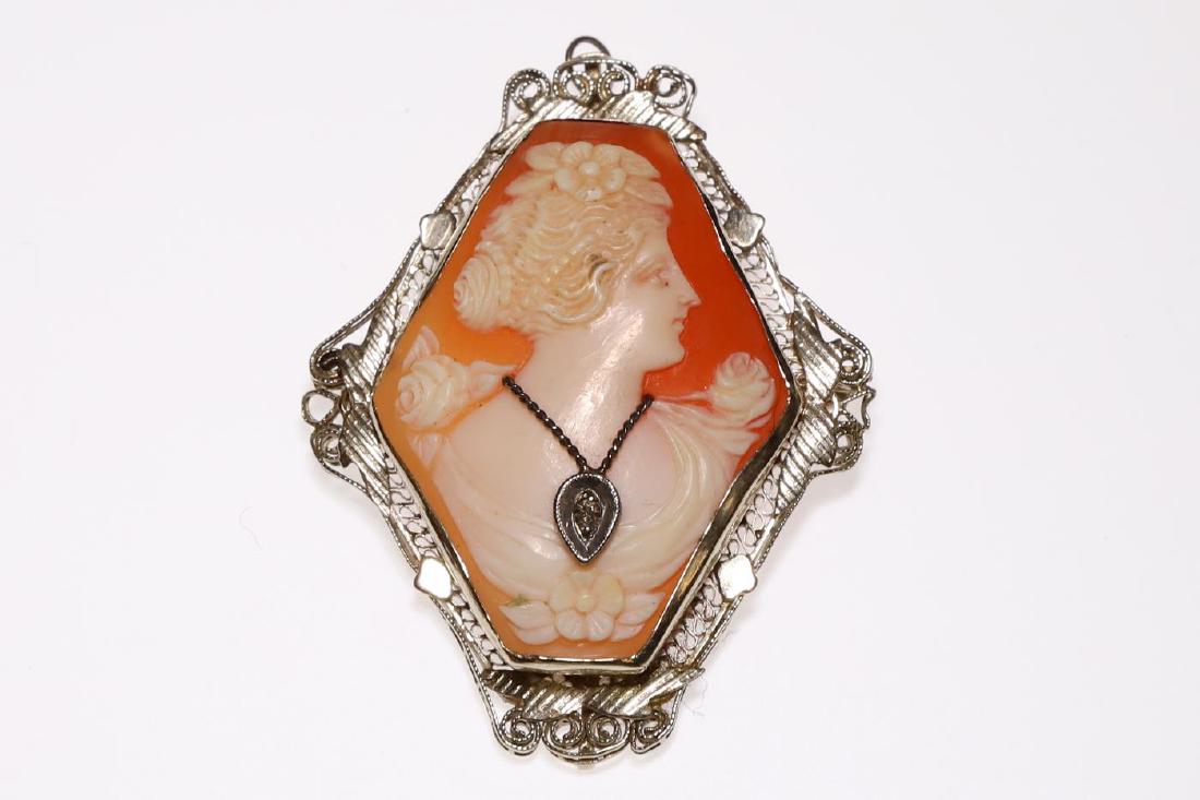 14k GOLD CAMEO BROOCH set with DIAMOND: Shell cameo bust wears gold necklace with diamond brooch. Cameo set in 14k white gold filigree. 2 inches. 5.4 dwt (overall)