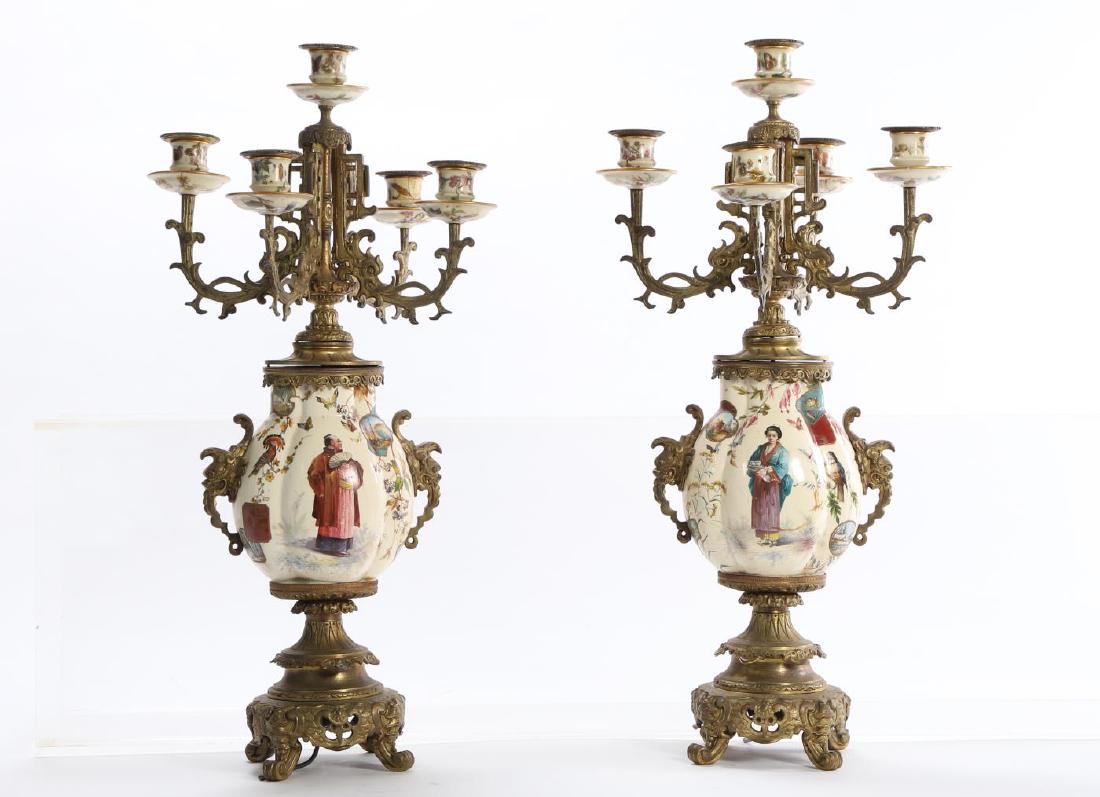 PAIR of JAPANISME BRONZE & PORCELAIN CANDELABRAS: (5) Light candelabras cast with Japanese inspired elements, porcelain vases with dragon-form ormolu mounts. Hand painted with Japanese man and woman in traditional dress. Each arm is cast with scrolle