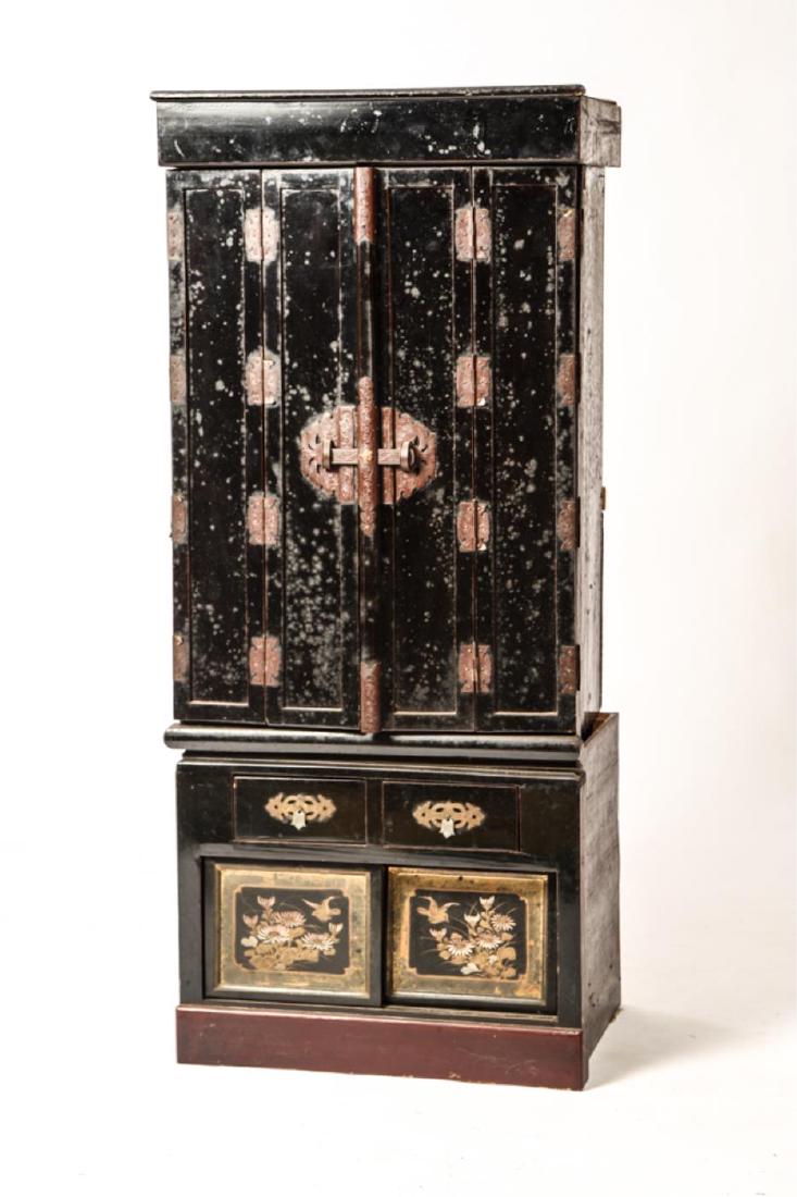 JAPANESE LACQUERED SHRINE CABINET: Gilt interior with (2) sets of folding doors and screens opening to shelving. Base with (2) drawers above cabinet with sliding doors. 41 x 18 x 13 1/2 inches.