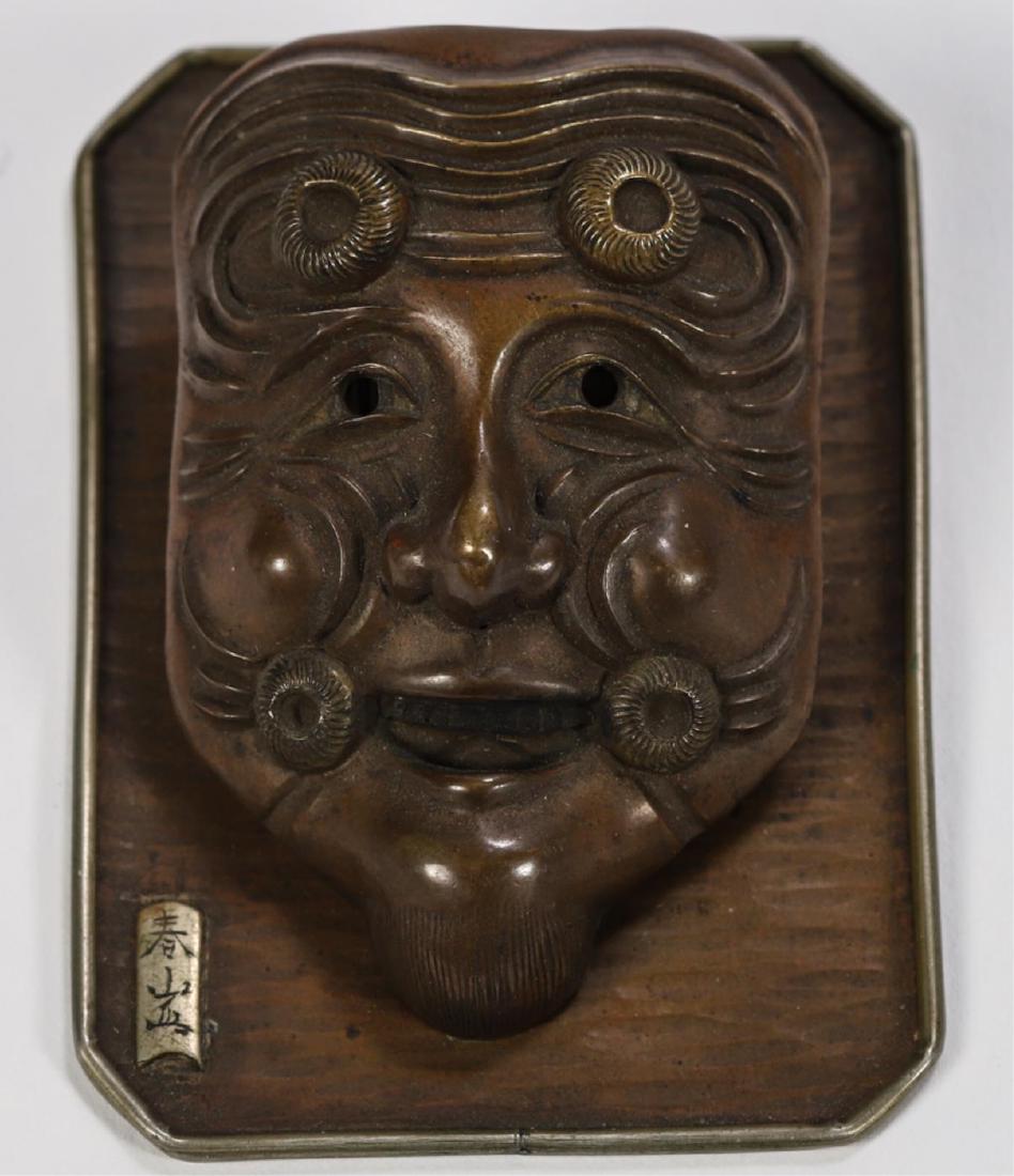 JAPANESE FIGURAL BRONZE DESK CLIP: Depicting a theatrical demon mask. signed. 2 3/4 x 2 inches.