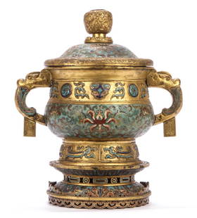 (19th c) CHINESE GILT BRONZE CLOISONNE URN: In (3) parts with cover, urn and coordinating stand. Lid finial and cover cast in low relief with running floral motif Urn cast and enameled with dragon-form handles and raised medallions and characte