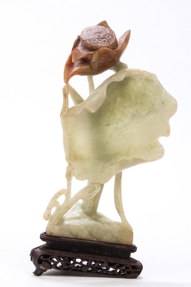CARVED CHINESE SOAPSTONE LOTUS FLOWER on STAND: Incorporating the natural color transition of the stone into the carving of the leaf and lotus flower seed pod. 8 1/2 inches.