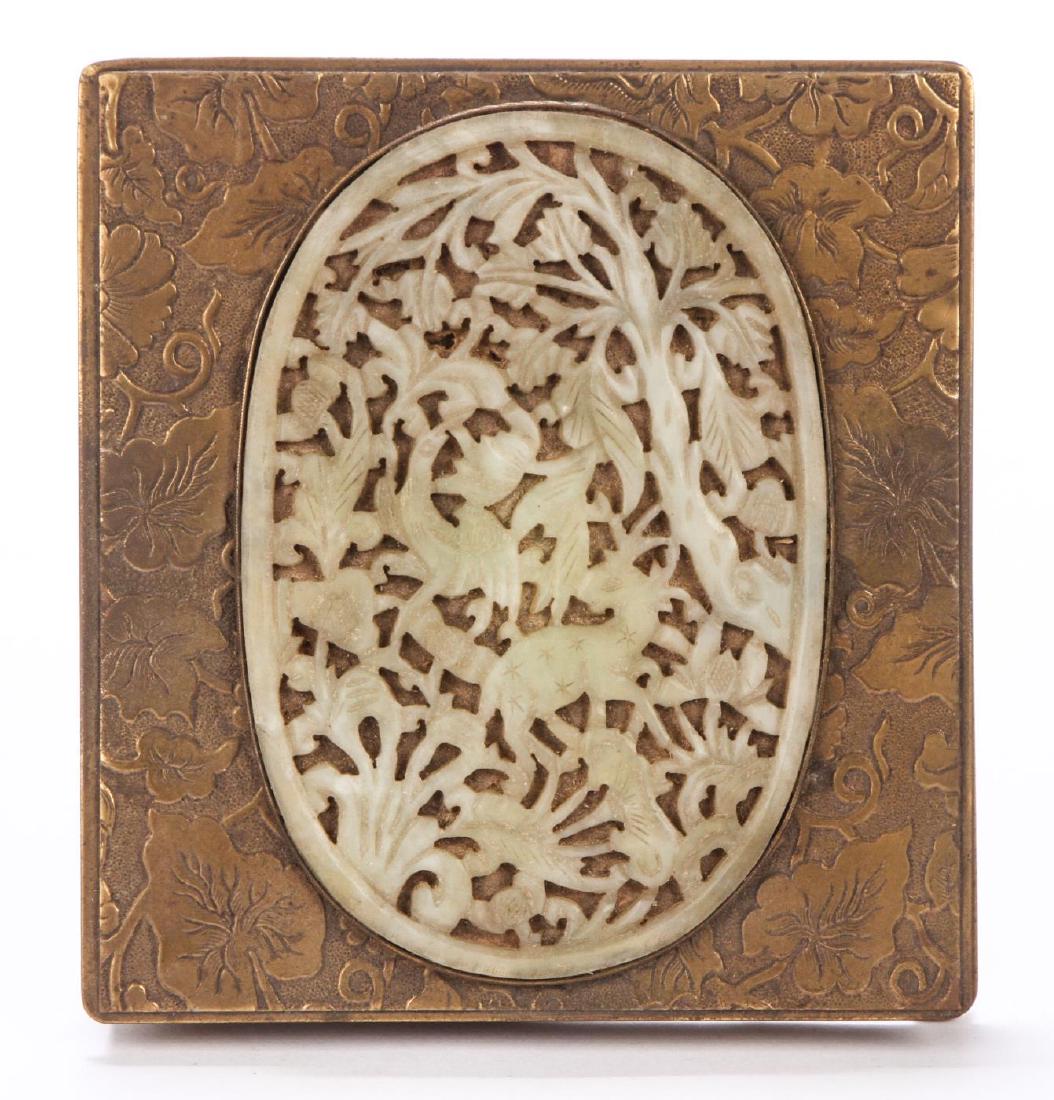 CHINESE CIGARETTE CASE SET with JADE PLAQUE: Pierced and carved with bird and deer within a forest landscape. Cedar lined case is embossed with leaf and vine motif and running geometric sides on ball feet. Plaque side sideways into case measures