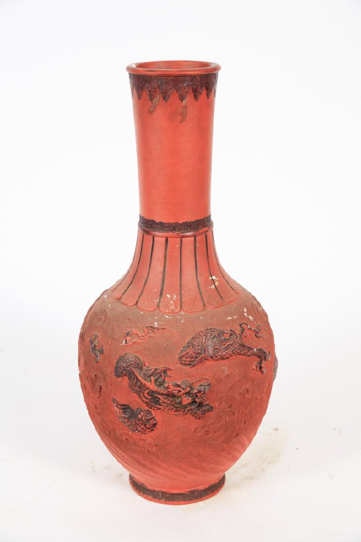 CHINESE YIXING ZISHA REDWARE VASE: Raised painted dragon with stippled clouds. 24 inches.