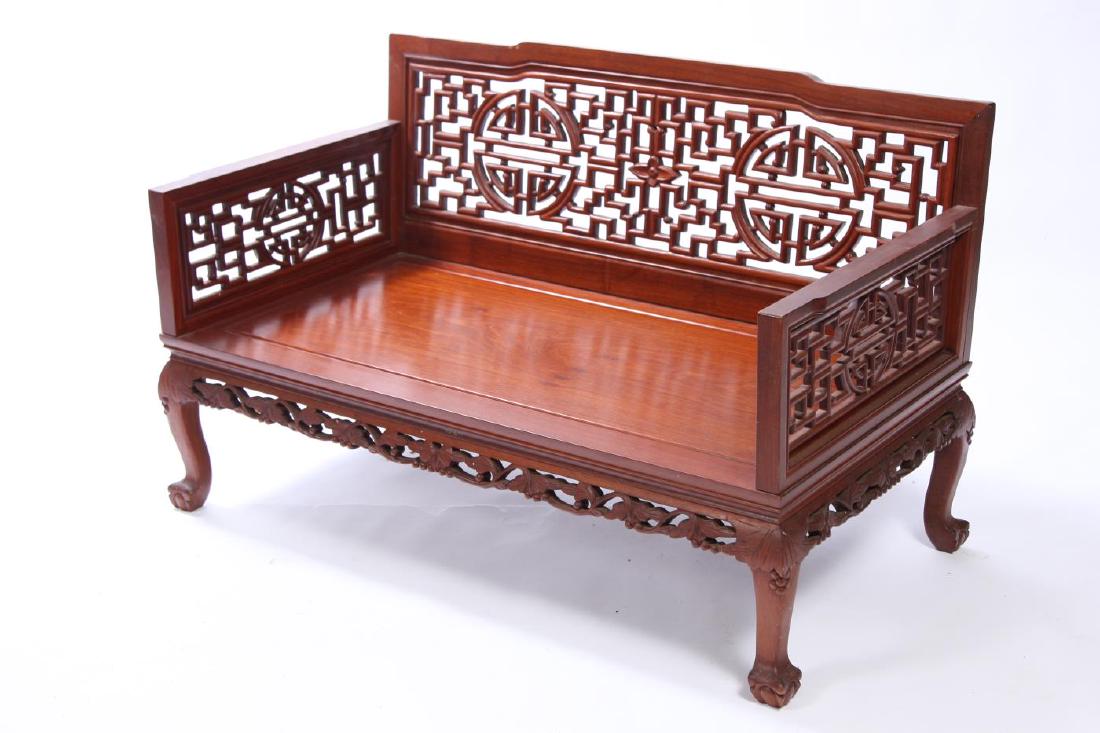PAIR OF MODERN VINTAGE CHINESE HARDWOOD SETTEES: Carved and pierced aprons and claw feet. 29 1/2 x 48 x 25 1/2 inches (each)