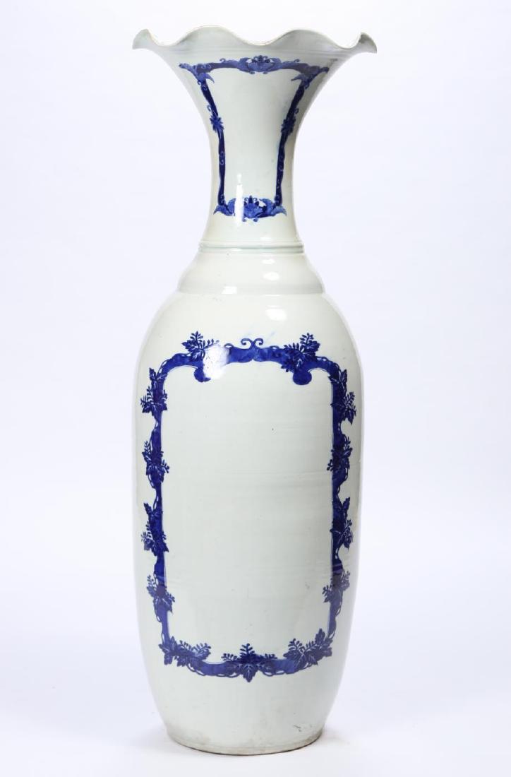 LARGE CHINESE PORCELAIN VASE with FLARED RIM: Clear glaze with cobalt Chinese Chippendale rococo cartouches. 48 1/2 inches. unsigned.