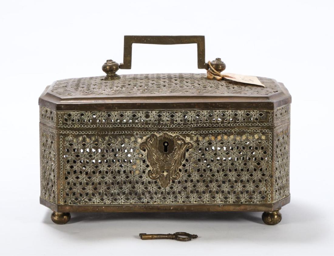 CHINESE BRASS CRICKET BOX with SWING HANDLE: Rectangular locking box with clipped corners, pierced and tooled with floral borders and ball feet. 7 x 12 x 8 inches.