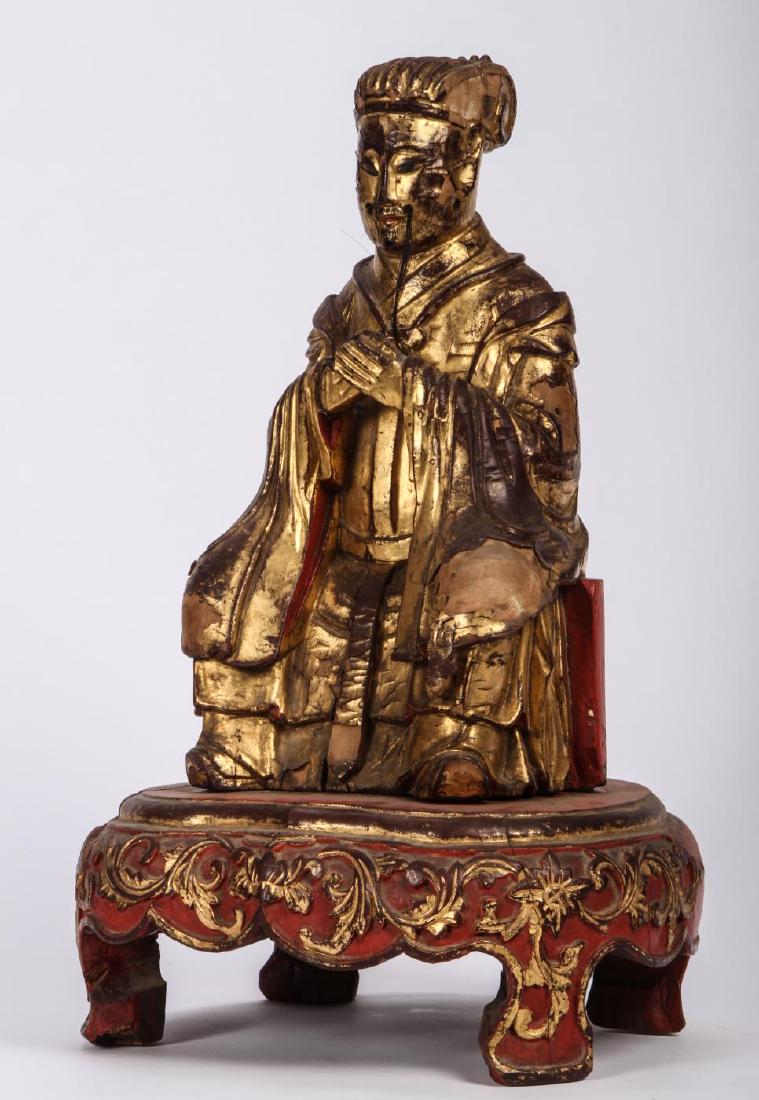 CARVED & GILT CHINESE “MANDARIN PRINCE” c. 1800: Carved gilt and lacquered wood with remnants of horse hair moustache. 18 inches (including base)