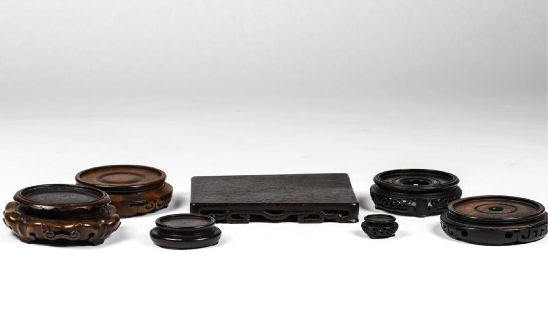 ASSORTMENT OF (9) CHINESE CARVED WOODEN STANDS: Approximately 8 inches to 1 1/4 inches in diameter. Condition: Good Temp No 3060