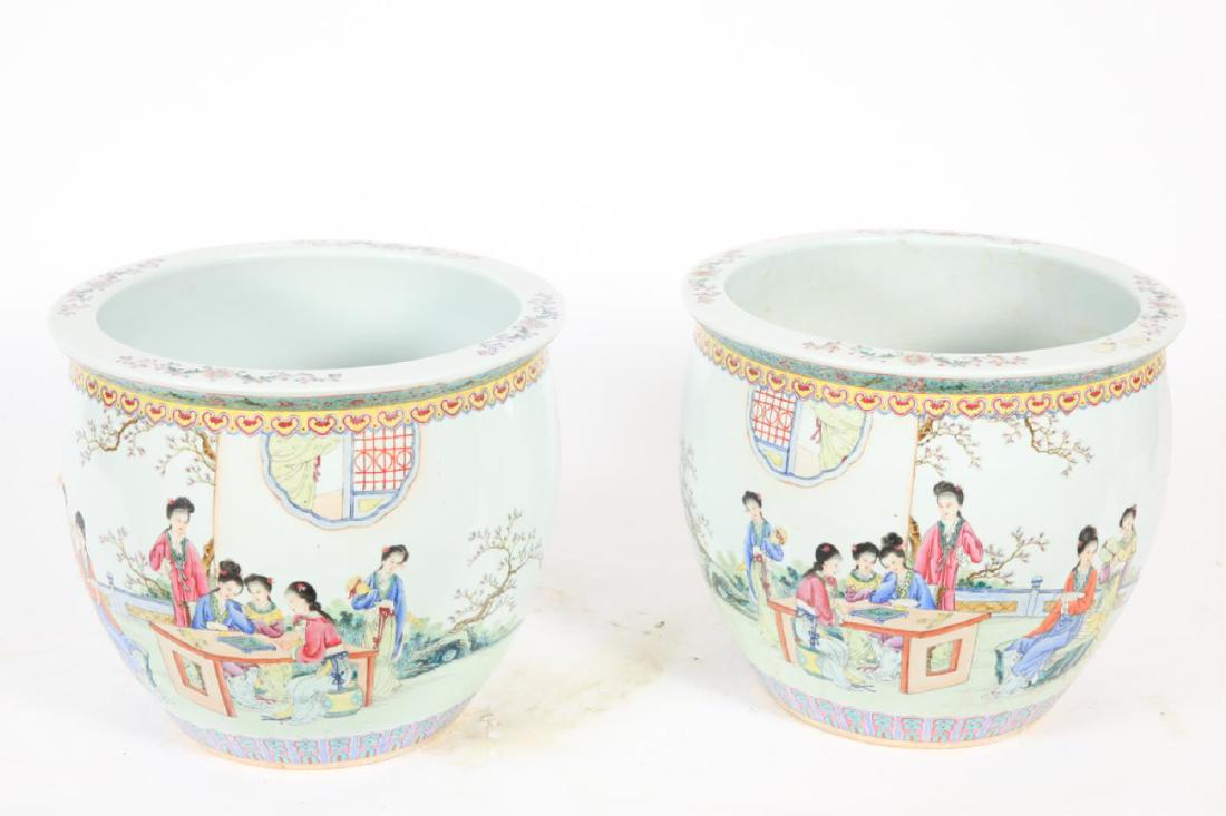 PAIR OF CHINESE PORCELAIN JARDINERES: "Woman Surround Table to Game in a Garden" and decorated with diaper bands and character script. 12 1/2 x 14 1/4 inches