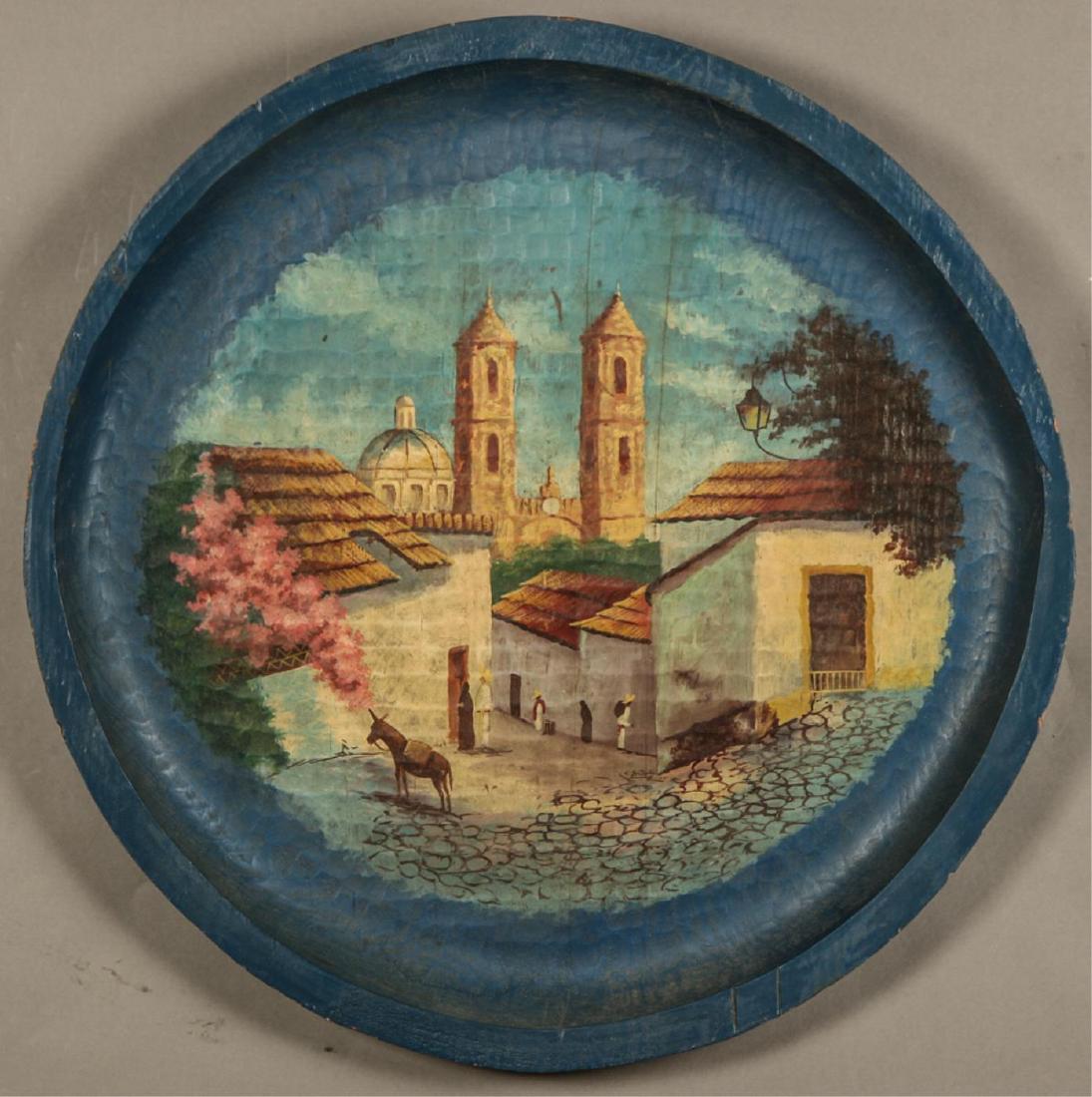 CARVED AND PAINTED CHARGER: "Spanish Colonial Mission Church" oil on hand carved wood. 27 1/2 inches