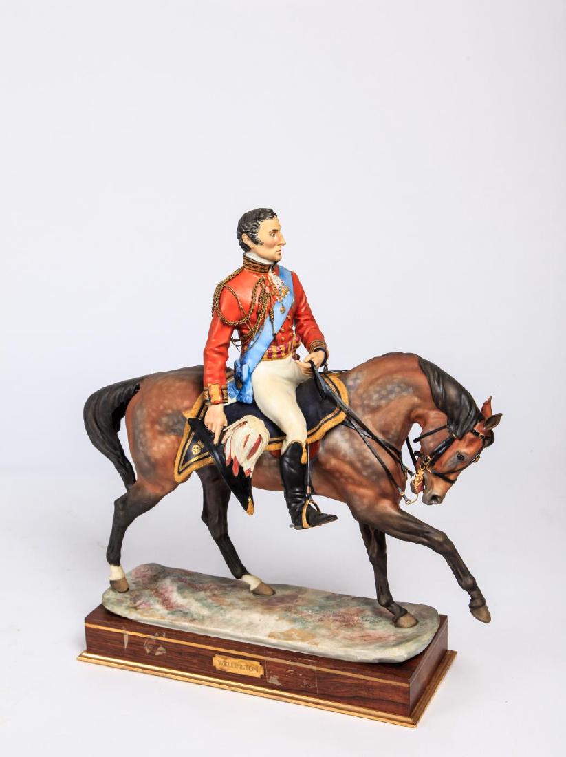ROYAL WORCESTER BISQUE FIGURINE OF WELLINGTON: Presented on a wooden base with plaque. 17 x 15 x 5 1/2 inches (Overall)