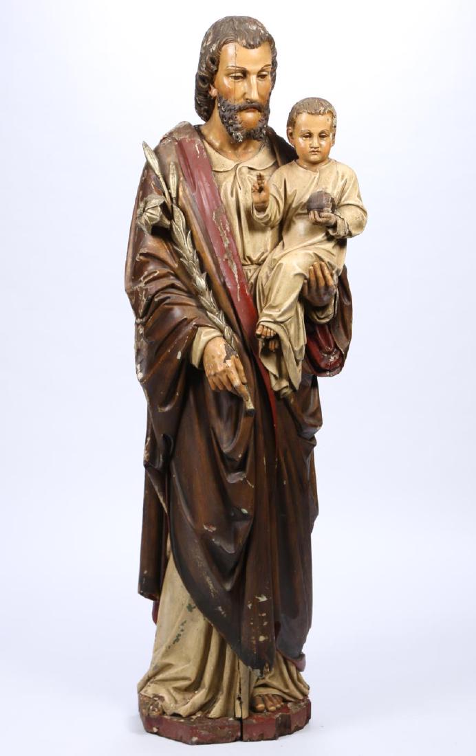 JOSEPH HOLDING the INFANT JESUS OF MECHELEN: Carved, painted and silver gilt wood. 64 inches.