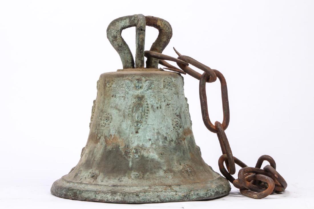 BRONZE MISSION BELL CAST WITH CHERUBS & MADONNA: Cast with four rings of winged cherubs, Madonnas and florets in low relief. 15 inches to top of canons (not including chain)