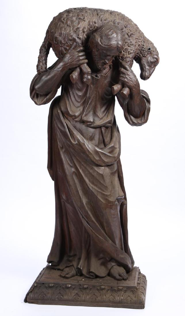“PARABLE of the LOST SHEEP” CARVED WOODEN STATUE: Italian School (19th c) Largely carved from a single piece of hollowed wood. 62 inches (including base carved with acanthus leaves)
