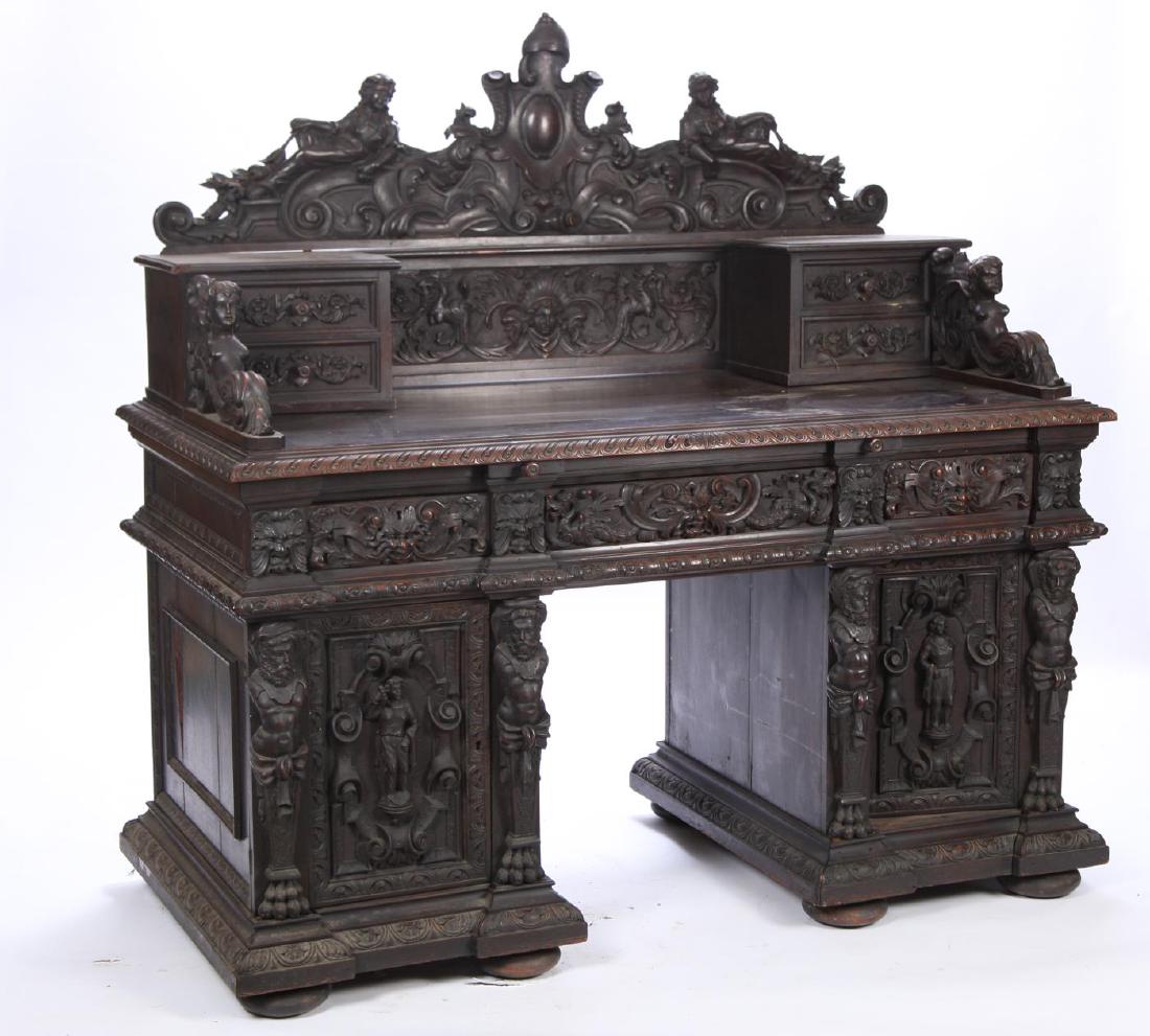 FIGURAL CARVED RENAISSANCE REVIVAL DESK: Crest carved with maidens, scrolls and armorial crest above scrolls and figures. Double bank desk with (2) upper drawers carved with scrolls and maiden returns. Molded desktop and pull-out desktop ext