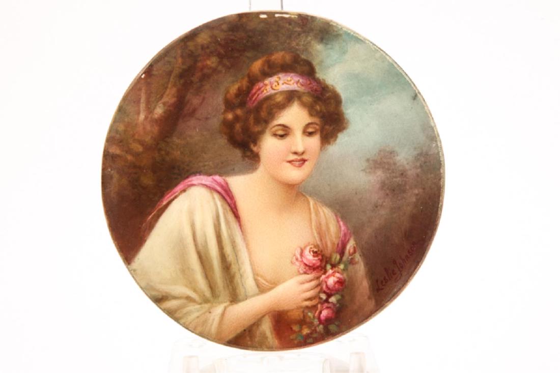 HAND PAINTED PORCELAIN MINIATURE: "Robed Woman Holding Roses" signed Leslie Johnson. 5 inches.