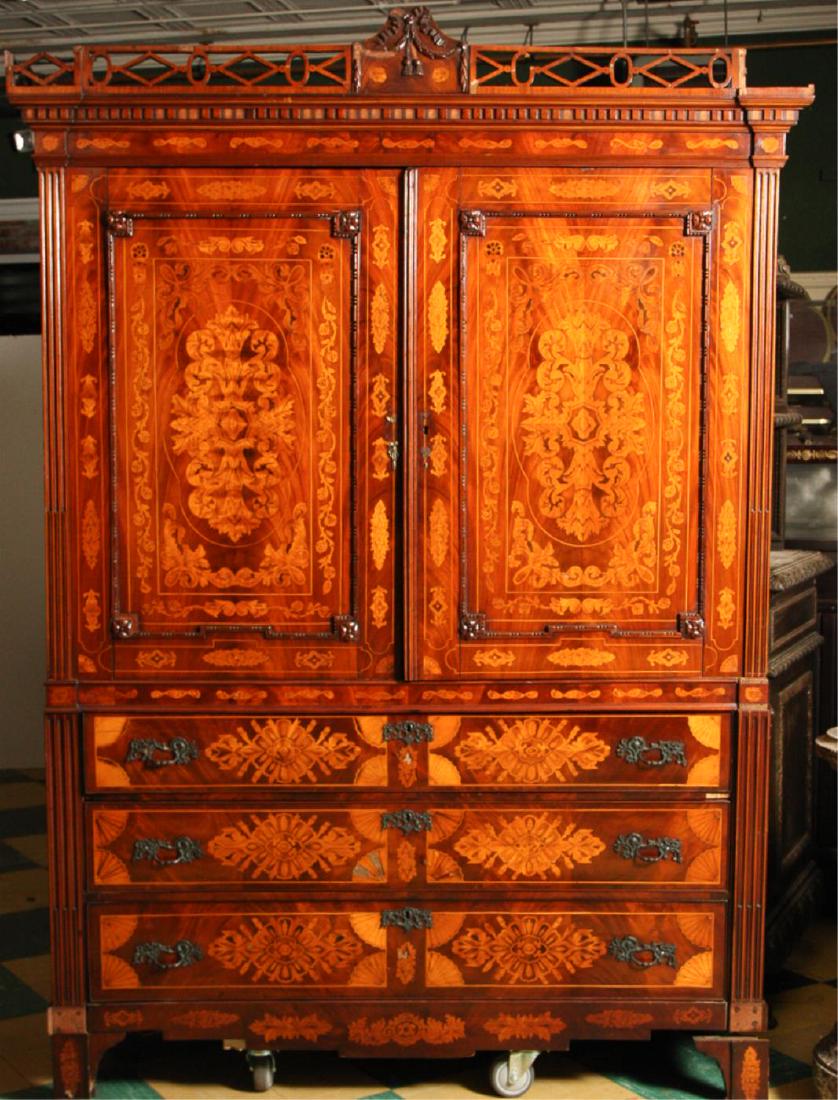 (18th c) DUTCH MARQUETRY LINEN PRESS: Original feet and cornice with open fretwork centered with ribbon and tassels, Embellished all-over with acanthus-leaves, fans, ribbons and tassels. (2) Paneled doors carved with florets and bead mold