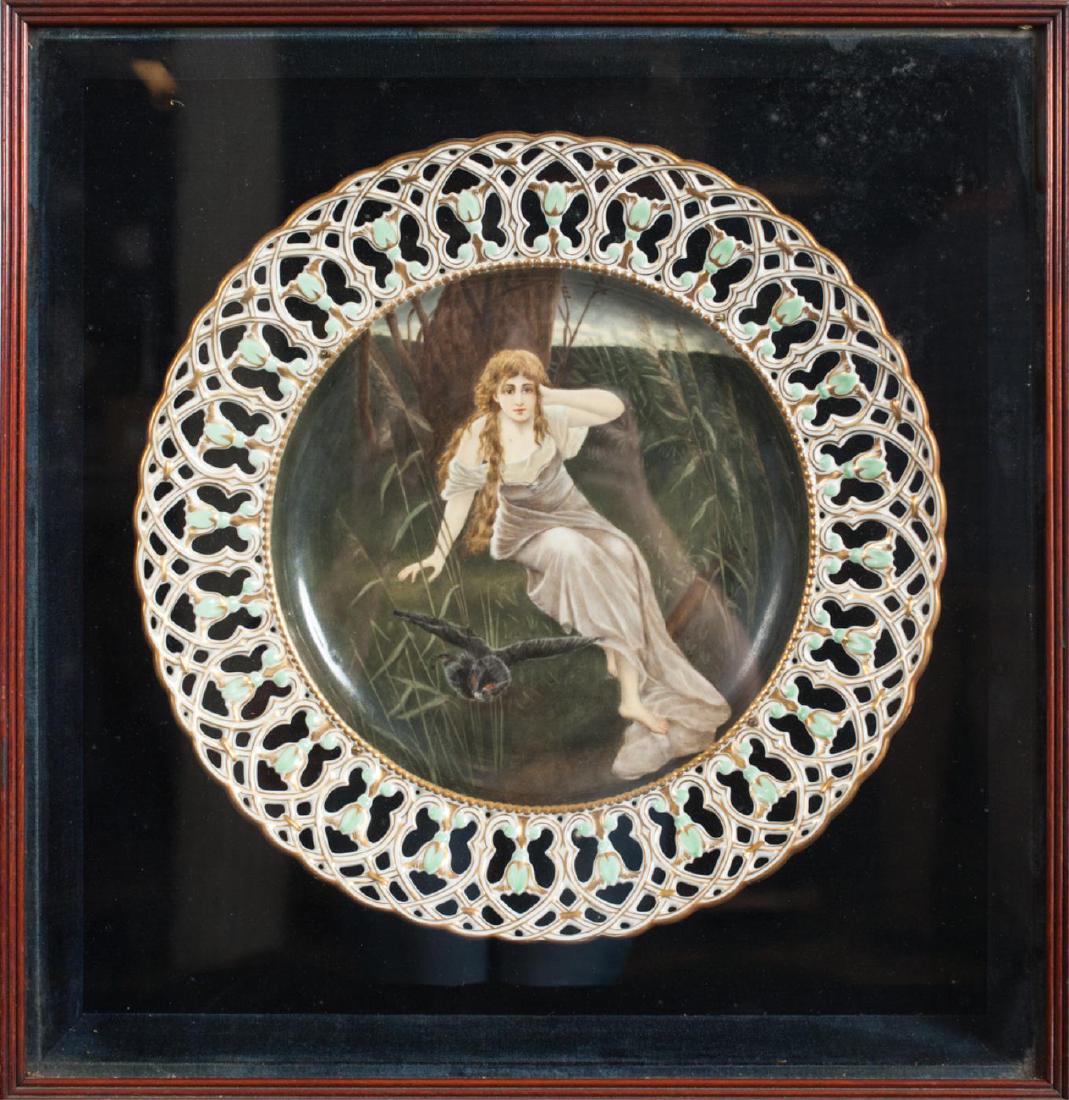 HAND PAINTED PORCELAIN CABINET CHARGER: Reticulated and gilt rim with hand painted well depicting a woman near a march with an owl. 13 inches. presented in a molded shadow box. 17 1/2 x 17 inches.
