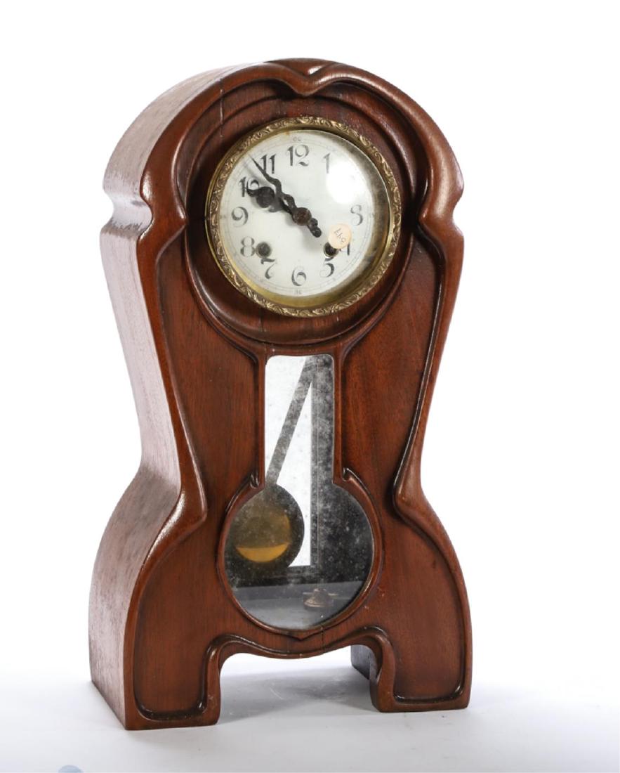 L. FURTWANLER & SOHNE ART NOUVEAU SHELF CLOCK: (5) inch enameled dial with chiming movement set in a finely carved case with a shaped pendulum window. 19 1/2 x 10 3/4 x 6 1/2 inches.