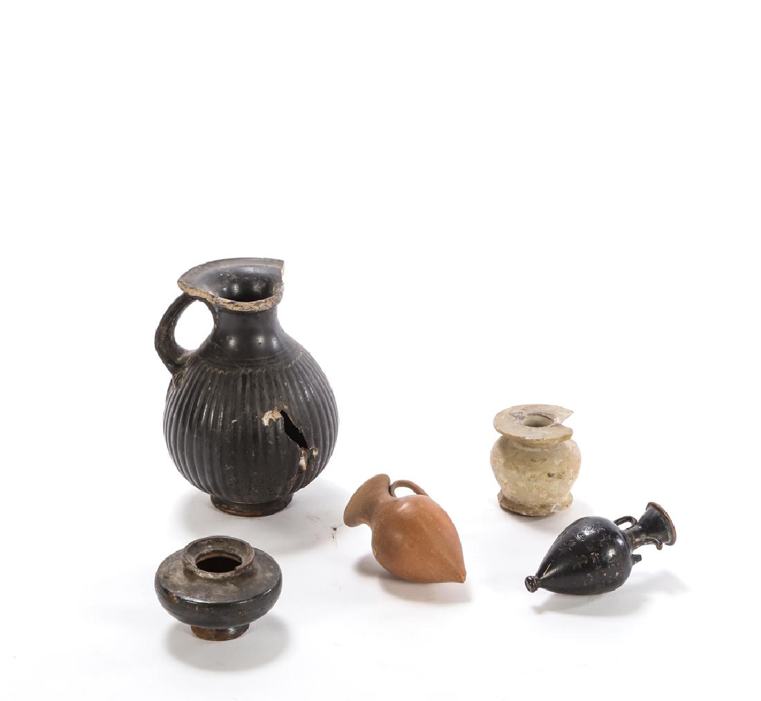 ANCIENT ROMAN POINTED AMPHORA MINI VASES ETC: (1) Volterra ribbed pitcher, (2) pointed amphora miniature vases (one incised), (1) small black glazed stoneware vase, (1) marble vase. 5 inches (and under)