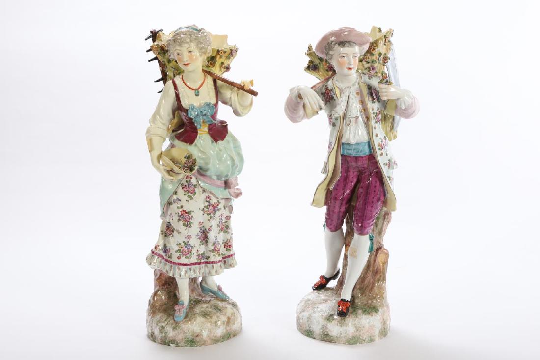 PAIR OF CONTINENTAL PORCELAIN FIGURAL VASES: Young man and woman collect flowers with sickle and rake. Free-form fonts on their backs. unsigned. 24 inches.