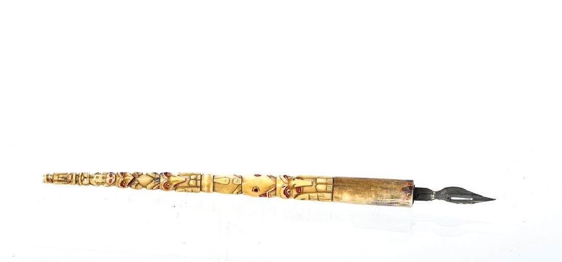 TOTEM POLE CARVED PEN GRIP: Eskimo/ Inuit carved (7) tier miniature totem pole highlighted with black and red paint. 7 3/8 inches (including nib)