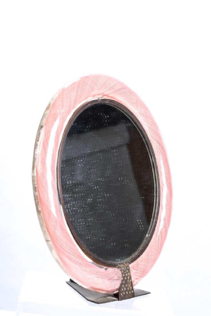 ITALIAN DECO MURANO GLASS DRESSING TABLE MIRROR: 11inch mirror with bronze bezel and stand is framed with 2 inch diameter Murano glass canework twist of pink threads. 16 x 15 x 5 inches (overall)