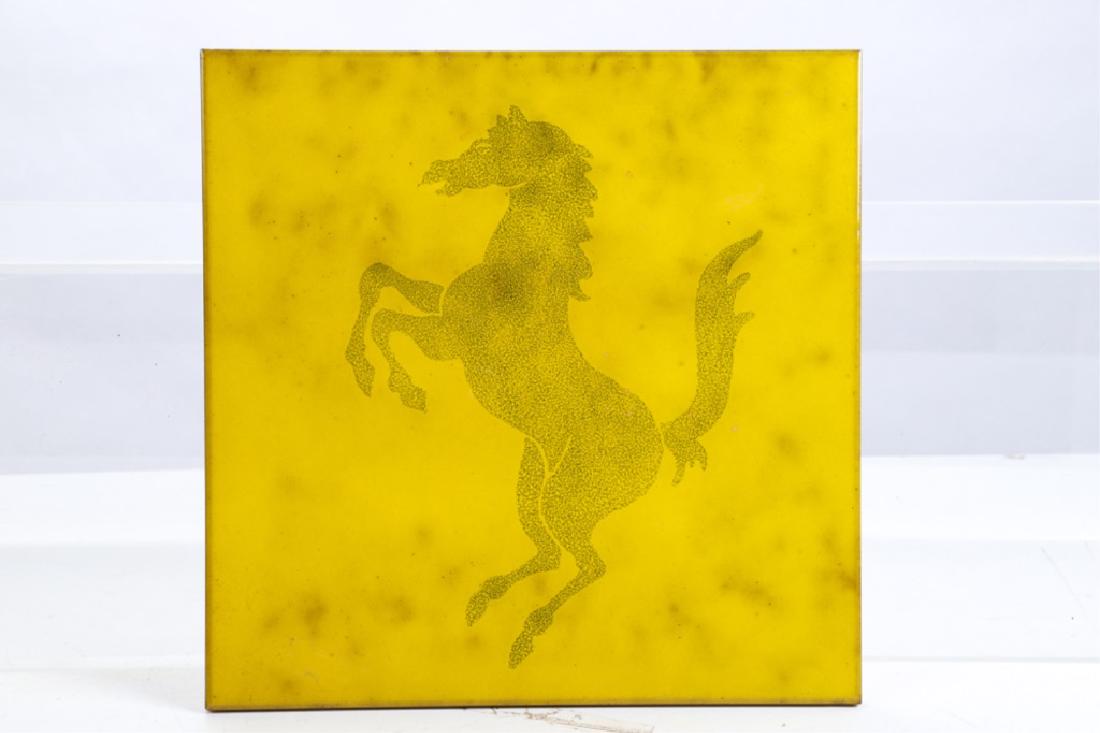 VINTAGE FERRARI TERRACOTTA DEALERSHIP TILE: Glazed terracotta. 13 x 13 inches. For many years the floors of all Ferrari dealerships in Italy were tiled with these beautiful yellow ceramic tiles. At the beginning of the last decade there were a