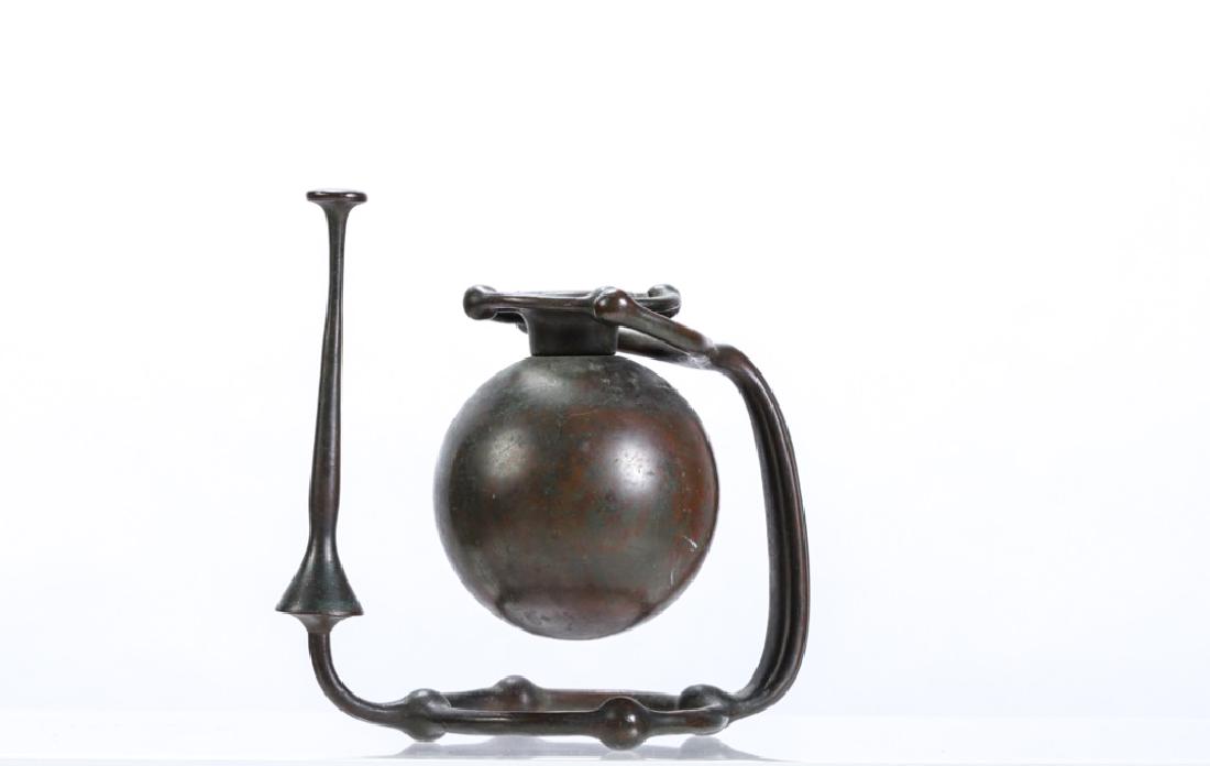 RARE TIFFANY STUDIOS BRONZE GIMBAL CANDLESTICK: Handle incorporated into stand. Snuffer lifts from base. Signed on handle. Tiffany Studios New York #1207. 7 1/4 x 8 x 4 1/2 inches.