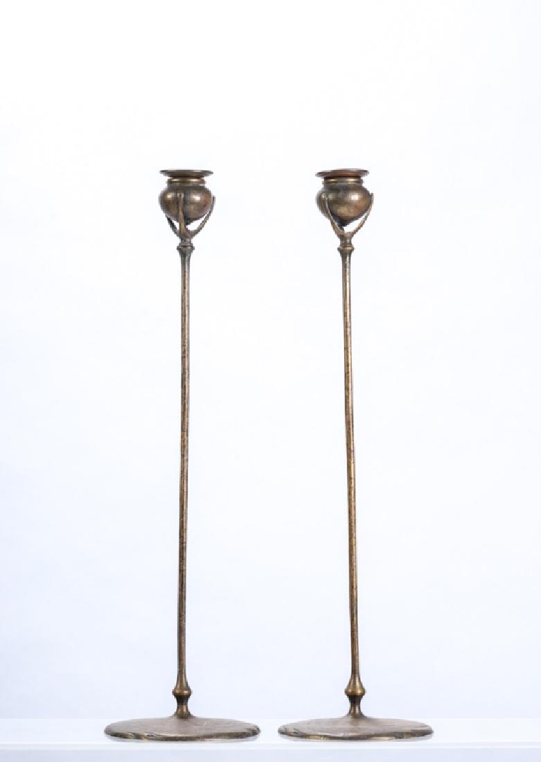 PAIR of TIFFANY STUDIOS BRONZE CANDLESTICKS #1213: "Molten" bronze surface treatment. 21 inches (including bobeches) signed Tiffany Studios New York #1213 (each)