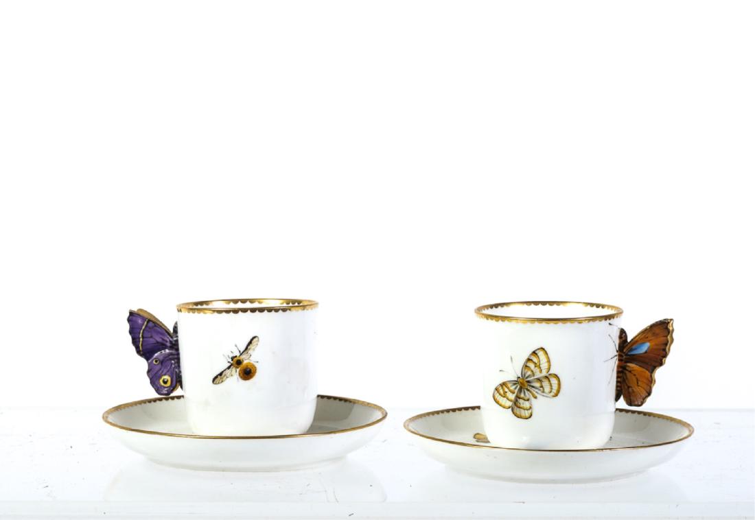 (2) ROYAL WORCESTER DEMI TASSE CUPS & SAUCERS: Hand painted with assorted butterflies and insects. Cups with full figured butterfly handles. Highlighted in gold. signed. 2 1/4 x 4 3/8 inches.