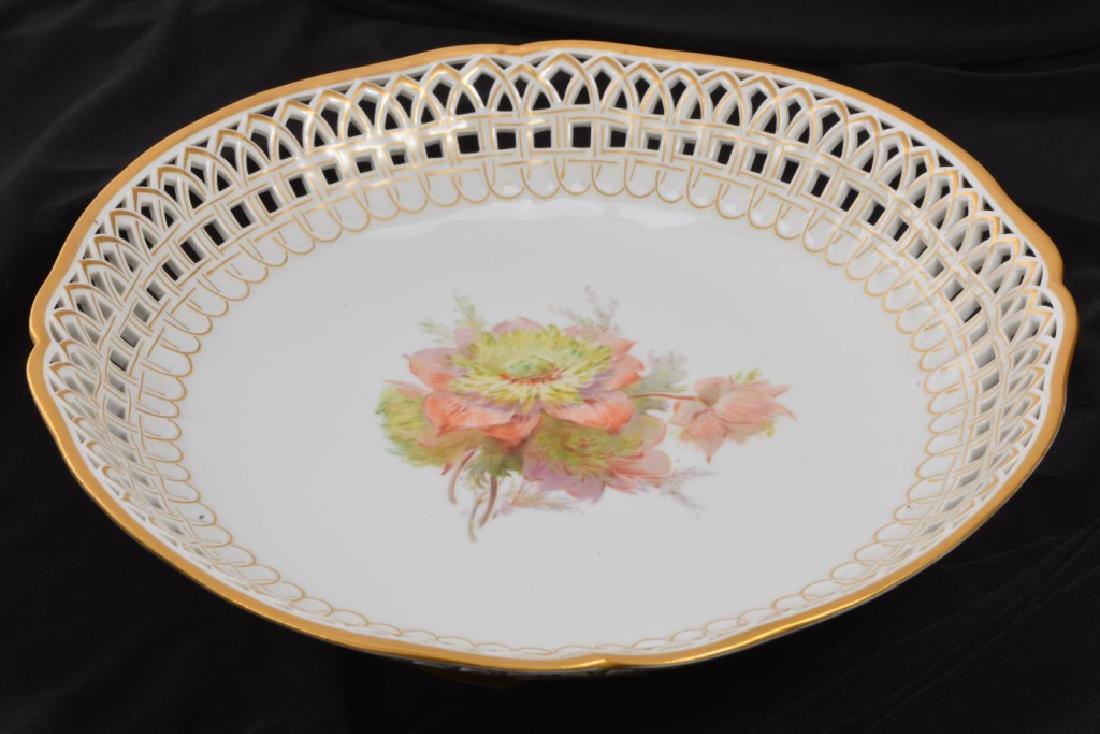 KPM RETICULATED PORCELAIN COMPOTE: Bowl hand painted with cut flowers. Reticulated rim and foot highlighted in gold. signed. 2 1/2 x 8 3/4 inches.