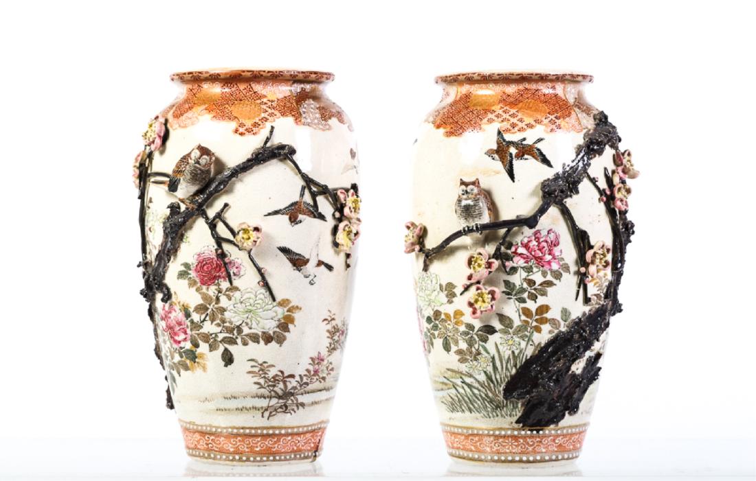 PAIR OF JAPANESE SATSUMA VASES: Unusual examples of Satsuma with modeled owls and branches in high relief over a hand painted floral garden and diaper patterns. unmarked. 10 1/2 inches.